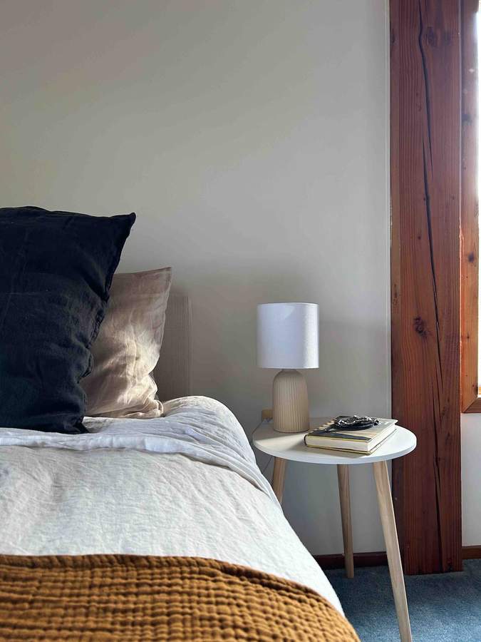 Bedroom one at Lofty Cabin with king bed, crisp linens and warm wood accents