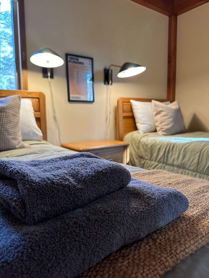 Upstairs bedroom with natural light at Lofty Cabin