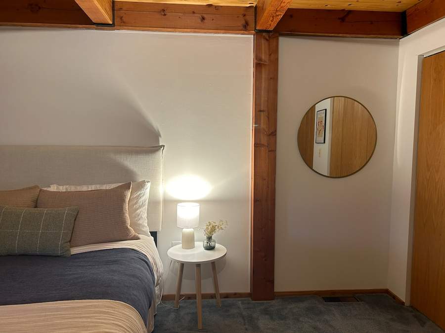 Fourth bedroom at Lofty Cabin with queen bed and peaceful woodland decor