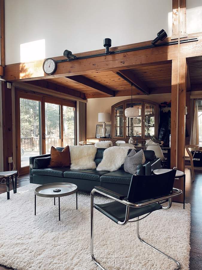 Vaulted living room with fireplace at Lofty Cabin
