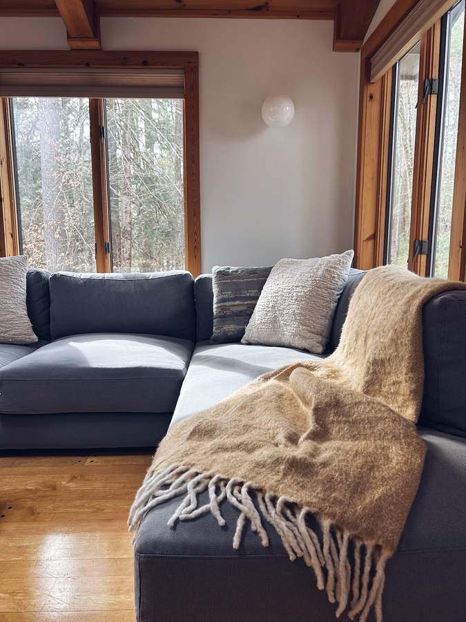 Sunlit den and game room at Lofty Cabin